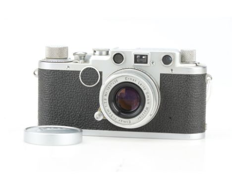 A Leica IIc 35mm Rangefinder Camera, chrome, serial no. 450818, body G, shutter working but sticks on slower speeds, with a L