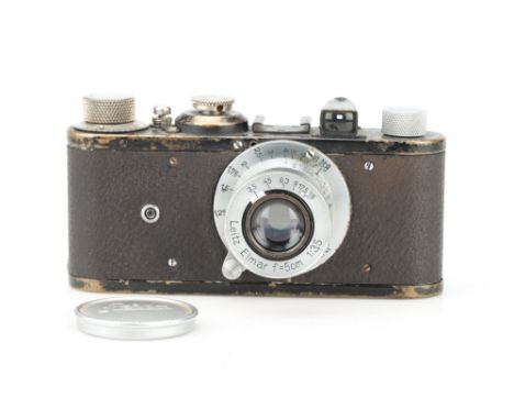 A Leica I 35mm Viewfinder Camera, chrome, serial no. 70522, body F-G, shutter curtain broken, with a Leitz Elmar 50mm f/3.5 l