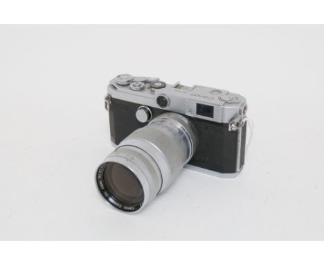 A Canon Model L2 Rangefinder Camera, chrome, with Canon f/3.5 135mm lens, body, F, shutter working but slowest speeds stickin