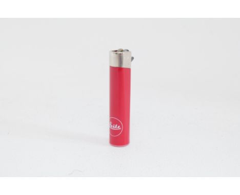 A Leica Cigarette Lighter, red, marked 'Leitz', in good working order