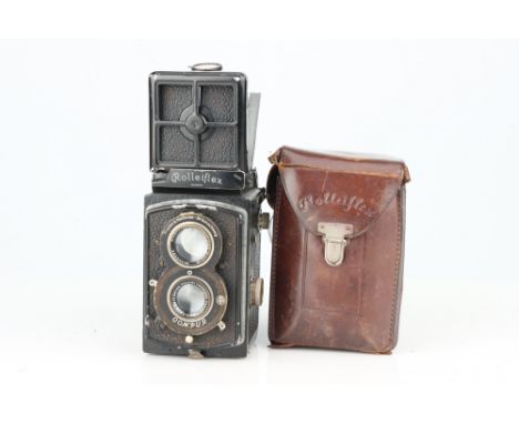 A Standard Rolleiflex Medium Format TLR Camera, black, body G, shutter working, some damage to the nameplate, with Zeiss Jena