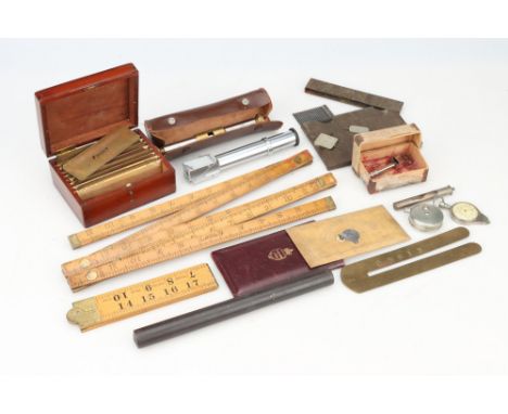 A Collection of Rules and Gauges etc, including a cased Sandhurst protractor by Elliott Bros with clinometer, a cased set of 