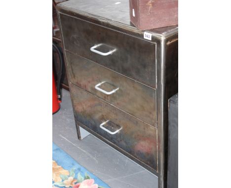 A VINTAGE INDUSTRIAL POLISHED STEEL CHEST OF THREE DRAWERS