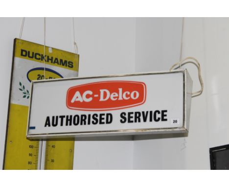 A VINTAGE AC DELCO ILLUMINATING SIGN