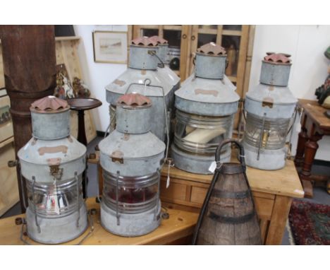 A SET OF SEVEN MATCHING VINTAGE GALVANISED SHIP LIGHTS WITH COPPER FITTINGS. HEIGHT 56cms