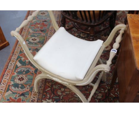 A CONTINENTAL X FRAME DRESSING STOOL