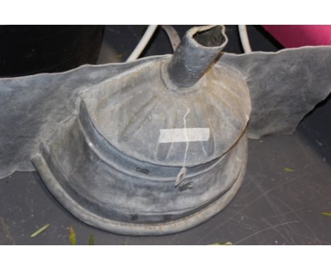 A LEAD RAINWATER HOPPER AND THREE SECTIONS OF A CAST IRON DRAIN PIPE