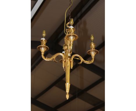 A GILT BRASS FRENCH FOUR LIGHT CHANDELIER
