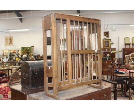 A VICTORIAN PINE PLATE DRYING RACK TOGETHER WITH A PINE TRUNK