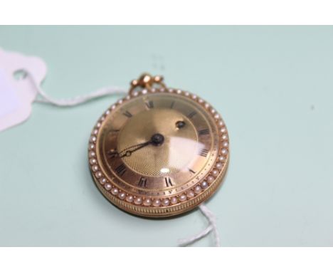 A GOLD COLOURED LADIES FOB WATCH WITH SPLIT PEARL BORDER