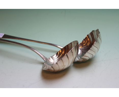 A GEORGE III IRISH SILVER SCALLOPED SOUP LADLE DUBLIN 1782 AND ANOTHER LONDON 1766 9OZS (2)