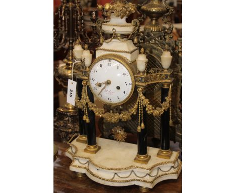 AN EARLY 19TH CENTURY ORMOLU AND MARBLE PORTICO FORM MANTLE CLOCK WITH BELL STRIKE MOVEMENT SIGNED TO THE DIAL LIOLAINE, PARI