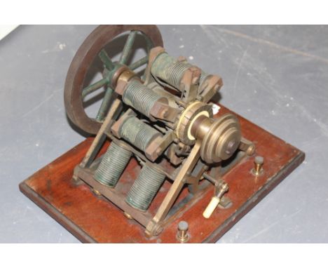 A RARE EARLY ELECTRIC MOTOR OR GENERATOR MOUNTED ON MAHOGANY PLINTH LABELLED APPS 433 STRAND - LONDON TOGETHER WITH A LATER M