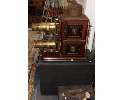 A RARE VICTORIAN BI-UNIAL MAGIC LANTERN WITH GILT BRASS FITTED MAHOGANY BODY TWIN TRIPLE ADJUSTMENT LENSES, RETAINS ORIGINAL 