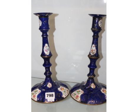 A PAIR OF ENGLISH LATE 18TH CENTURY ENAMEL CANDLESTICKS.