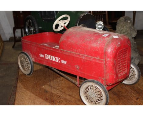 A VINTAGE TIN PLATE CHILD'S PEDAL CAR DUKE