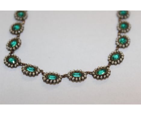 A 19TH CENTURY SEED PEARL AND GREEN PASTE SET NECKLACE AND TWO PASTE STUDS (3)