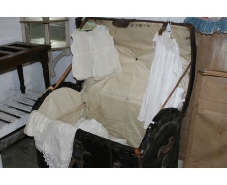A COLLECTION OF CHILDREN'S VICTORIAN AND LATER DRESSES WITHIN A CONTEMPORARY LEATHER COVERED DOME TOP TRAVELLING TRUNK TOGETH