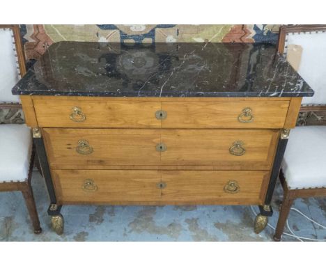 COMMODE, 19th century, the black marble top over three drawers flanked by Empire style elongated figural detail on gilt wood 