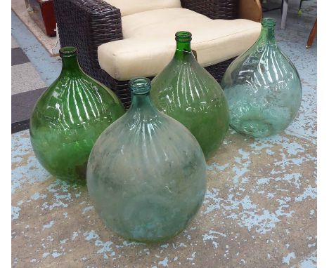 DEMI JOHNS, a set of four, vintage French provincial glass, 67cm H. (4)