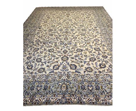 FINE KASHAN CARPET, 426cm x 302cm, all over palmette and scrolling vine design on a jade field within corresponding bands and