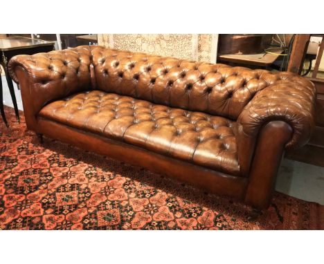 CHESTERFIELD SOFA, Victorian style hand finished leaf brown leather with deep button upholstered back, arms and seat on turne