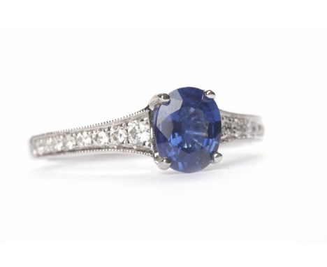SAPPHIRE AND DIAMOND RINGset with an oval sapphire of approximately 0.97 carats on diamond shoulders with stones totalling an