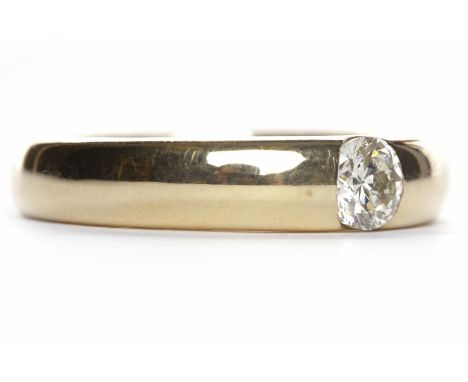 DIAMOND SOLITAIRE RINGthe round brilliant cut diamond of approximately 0.50 carats tension set in a fourteen carat gold band,