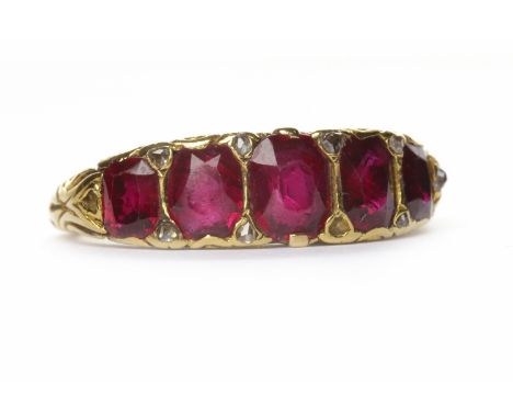 FIVE STONE RUBY AND DIAMOND RINGthe graduated rubies on an unmarked band, size K, weighing apprximately 5.20 grams