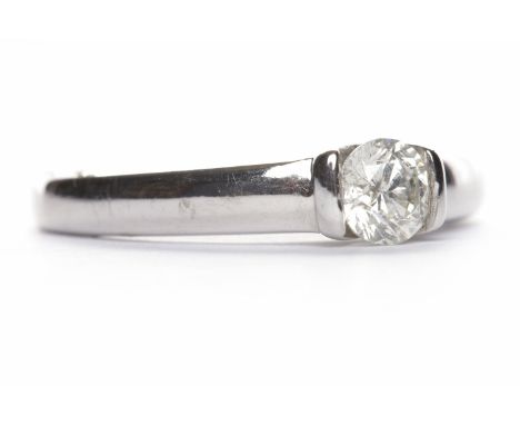 DIAMOND SOLITAIRE RINGthe round brilliant cut diamond of approximately 0.32 carats tension set in eighteen carat white gold, 