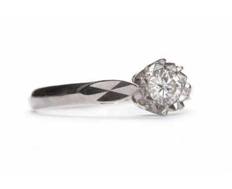 DIAMOND SOLITAIRE RINGthe round brilliant cut illusion set diamond of approximately 0.16 carats in eighteen carat white gold,