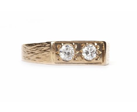 DIAMOND TWO STONE RINGset with two round brilliant cut diamonds of approximately 0.10 carats each, in nine carat gold, size K