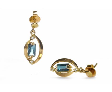 PAIR OF GEM SET DROP EARRINGSeach with an oval drop section set with a central rectangular step cut gem, in fourteen carat go