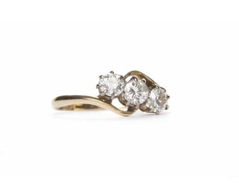 DIAMOND THREE STONE RINGthe diamonds totalling approximately 0.69 carats, in eighteen carat yellow gold, size K-L, 2g