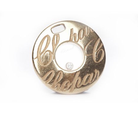 CHOPARD HAPPY DIAMONDS EIGHTEEN CARAT GOLD PENDANTof circular form, with central glass covered free moving single round brill