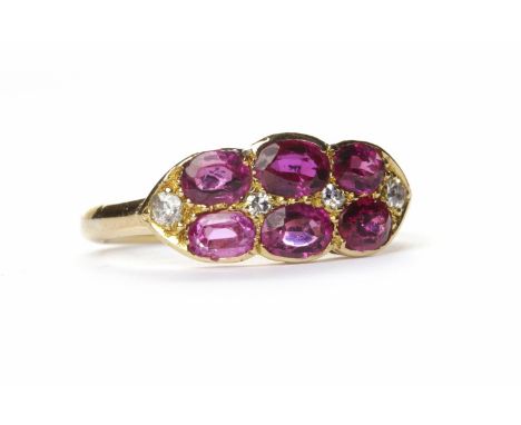 RUBY AND DIAMOND DRESS RINGset with six oval rubies interspaced by round brilliant cut diamonds, in eighteen carat yellow gol