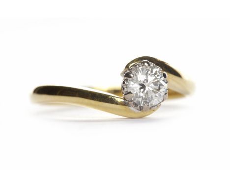 DIAMOND SOLITAIRE RINGthe round brilliant cut diamond of approximately 0.27 carats in a twist setting, in eighteen carat gold