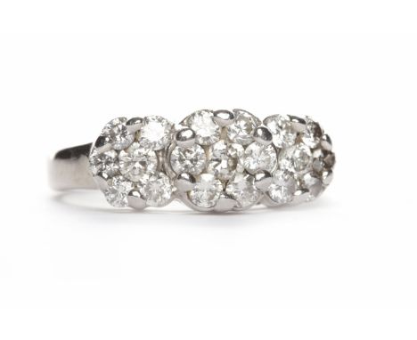 FOURTEEN CARAT WHITE GOLD DIAMOND CLUSTER RINGwith three clusters of round brilliant cut diamonds, size K, 4.5g