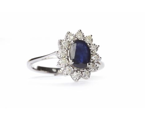 SAPPHIRE AND DIAMOND CLUSTER RINGthe central oval sapphire of approximately 0.50 carats surrounded by round brilliant cut ill
