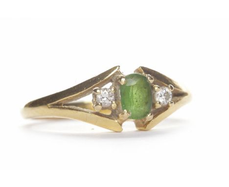 GEM AND DIAMOND SET RINGthe oval green gem flanked by two round diamonds, unmarked, size K, 3.2g