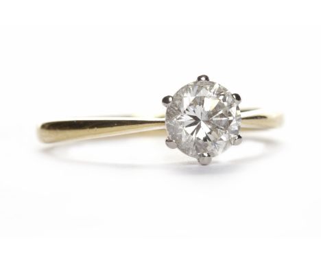 DIAMOND SOLITAIRE RINGthe round brilliant cut stone of approximately 0.68 carats in eighteen carat gold, size K, 2.1g