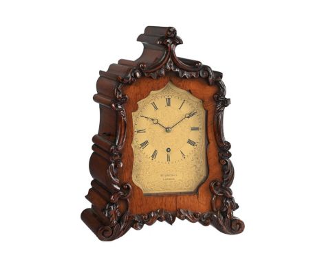 Y A VICTORIAN CARVED ROSEWOOD SMALL MANTEL TIMEPIECE WITH PASSING STRIKEBLUNDELL, LONDON, MID 19th CENTURYThe four columnar p