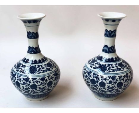 VASES, a pair, Chinese blue and white ceramic of gourd form with foliate detail, 32cm H. (2)