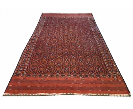 TURKOMAN SOUMAK CARPET, 380cm x 217cm, geometric field within matching borders.