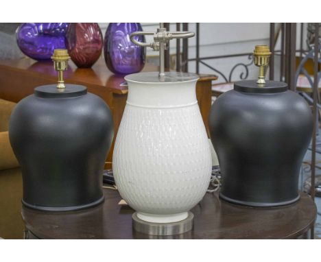 TABLE LAMPS, a pair, matt black, bases each 37cm H, and a cream table lamp, 41cm H. (3)