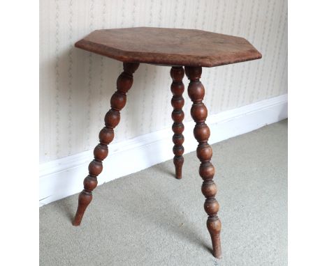 AN OAK 'GYPSY' TABLE19th/20th century, the octagonal top on three tapered bobbin turned legs, 63cm high x 53cm wide