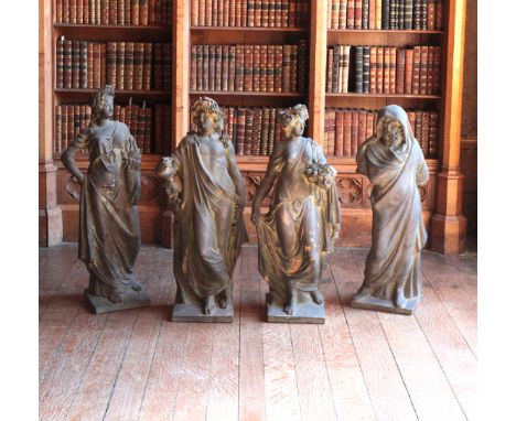 A GROUP OF FOUR 'BRONZED TERRACOTTA' ALLEGORICAL FIGURES OF THE FOUR SEASONScomprising Winter figured as a bearded gentleman 