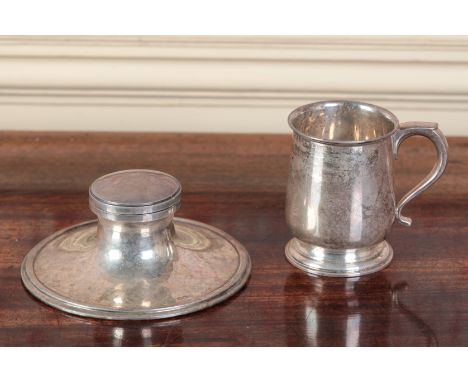 A GEORGE V SILVER CIRCULAR CAPSTAN INKWELLby William Hutton & Sons, Sheffield 1936, the wide spreading foot with simple rim, 