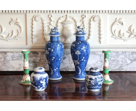 A PAIR OF CHINESE PORCELAIN BLUE AND WHITE BALUSTER VASES AND COVERSbearing four character Kangxi marks to the base, with lio
