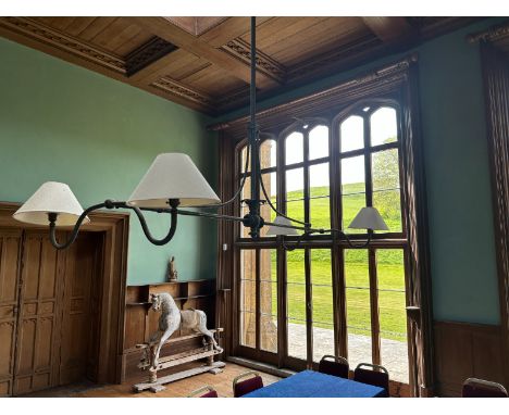 A REGENCY BRASS HANGING 'BILLIARDS' LANTERN 19th century, the long stem and horizontal bar issuing four shaded lights, with f